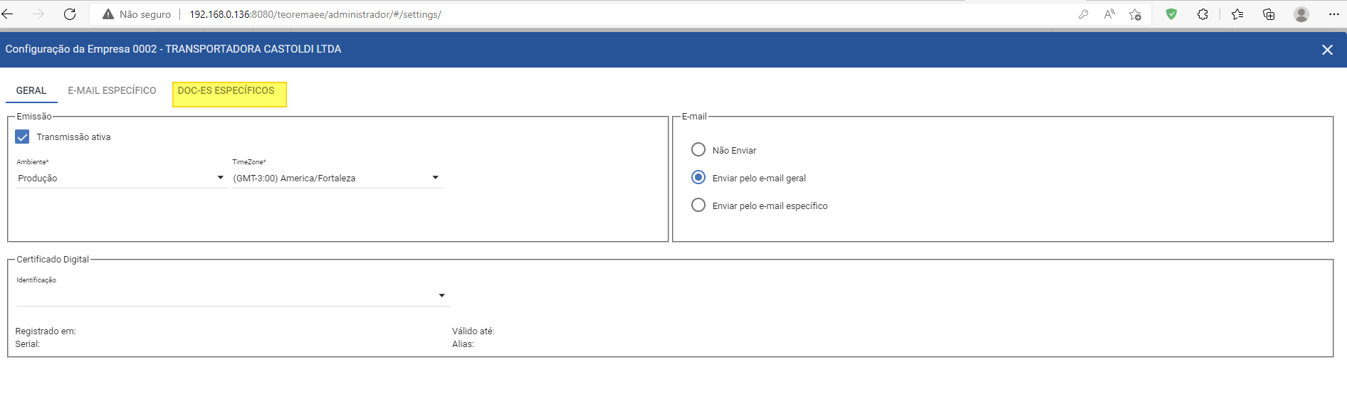 Janela Configuração da Empresa com abas GERAL, E-MAIL ESPECÍFICO e DOC-ES ESPECÍFICOS (destacada); aba GERAL exibe seção Emissão com campo Ambiente Produção e seção E-mail com opções Não Enviar, Enviar pelo e-mail geral e Enviar pelo e-mail específico